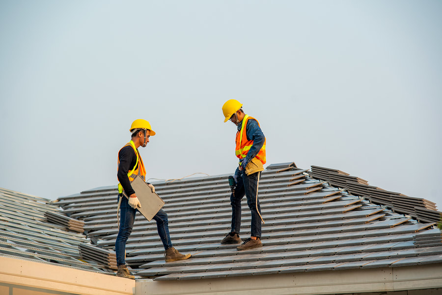 men inspecting the roof's condition